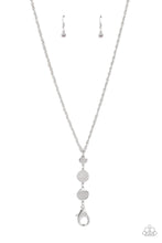 Load image into Gallery viewer, A white rhinestone encrusted silver frame is flanked between two silver discs scratched in a glistening shimmer as they drip from an ornately double-linked silver chain down the chest. A lobster clasp hangs from the bottom of the design to allow a name badge or other item to be attached. Features an adjustable clasp closure.  Sold as one individual lanyard. Includes one pair of matching earrings.
