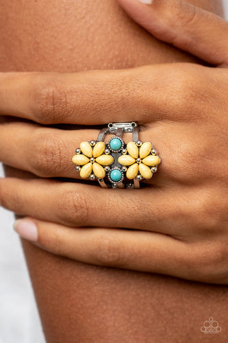 Flanked by dainty turquoise stones, a pair of yellow stone petaled flowers blooms atop layered silver bands for an artisan inspired floral fashion. Features a stretchy band for a flexible fit.  Sold as one individual ring.