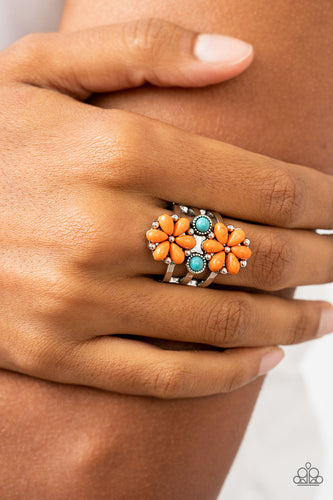 Flanked by dainty turquoise stones, a pair of orange stone petaled flowers blooms atop layered silver bands for an artisan inspired floral fashion. Features a stretchy band for a flexible fit.  Sold as one individual ring.