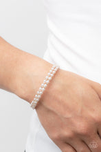 Load image into Gallery viewer, Dainty white pearls and white rhinestone dotted gold fittings alternate along an infinity wire around the wrist, resulting in wraparound shimmer.  Sold as one individual bracelet.
