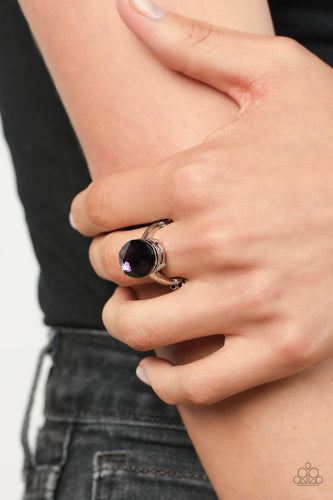 A stunning faceted plum gem, set in edgy pronged fittings, creates a glamorous show-stopping centerpiece atop sleek silver bands. Features a dainty stretchy band for a flexible fit.  Sold as one individual ring.
