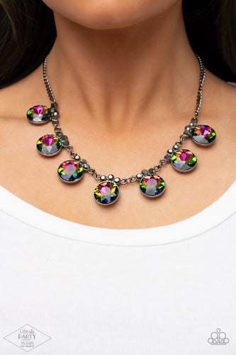 Crowned in a trio of dainty hematite rhinestones, an exaggerated display of oversized oil spill gems delicately link below the collar for a glamorous glow. Features an adjustable clasp closure.  Sold as one individual necklace. Includes one pair of matching earrings.