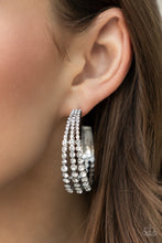 Load image into Gallery viewer, Cascading layers of sparkling white rhinestones plunge into flattened silver plates creating a stunning eye-catching hoop earring. Earring attaches to a standard post fitting. Hoop measures approximately 2&quot; in diameter.  Sold as one pair of hoop earrings.
