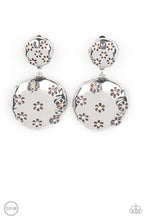 Load image into Gallery viewer, Dotted with dainty iridescent pink rhinestone centers, an antiqued floral pattern is stamped across the fronts of two hammered silver discs that delicately connect into a rustic lure. Earring attaches to a standard clip-on fitting.
