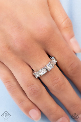 A gorgeous white rhinestone solitaire is bordered by marquise cut rhinestones tipped onto their sides followed by dainty rhinestones that add an endearing touch to the sentimental band. Features a dainty stretchy band for a flexible fit.  Sold as one individual ring.