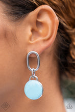 Load image into Gallery viewer, A disc painted in pastel blue enamel is set in a simple silver frame, where it sways from the bottom of an oblong silver link to create a charming modern lure. Earring attaches to a standard post fitting.  Sold as one pair of post earrings.
