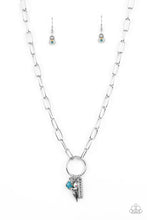 Load image into Gallery viewer, A simple silver hoop is centered between strands of oblong silver chain links. A collection of charms swings from the airy hoop, including a silver bar stamped with the word &quot;Believe&quot;, a silver bird charm, a faceted blue gem, and a dainty iridescent rhinestone. Features an adjustable clasp closure. Due to its prismatic palette, color may vary.  Sold as one individual necklace. Includes one pair of matching earrings.
