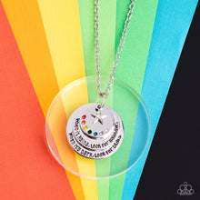 Load image into Gallery viewer, Dotted in a rainbow of dainty rhinestones, a shiny silver disc sits atop two overlapping silver discs that gradually increase in size.  Sold as one individual necklace. Includes one pair of matching earrings.
