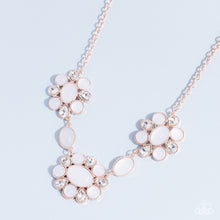 Load image into Gallery viewer, Brilliant, white, teardrop-shaped rhinestones, set in rose gold fittings, are set between glassy opalescent beads in the tranquil shade of white, wrapping around an oval bead in the same white tint to create three floral-inspired clusters.  Sold as one individual necklace. Includes one pair of matching earrings.
