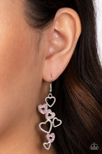 Load image into Gallery viewer, A collection of airy, heart-shaped silhouettes fall from the ear in a bubbly cascade. In a haphazard pattern, the sleek and simple silver frames alternate with those lined with sparkling light rose rhinestones, culminating in a flirtatious lure. Earring attaches to a standard fishhook fitting.  Sold as one pair of earrings.
