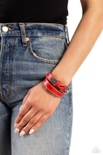 Load image into Gallery viewer, Featuring a weathered finish, a red leather band loops around the wrist in a belt loop fashion. Featured at the end of the loop, the leather braids into a silver cap fitting, embossed with a coat of arms style filigree for an urban statement. Features an adjustable belt loop closure.   Featured inside The Preview at Made for More! Sold as one individual bracelet.
