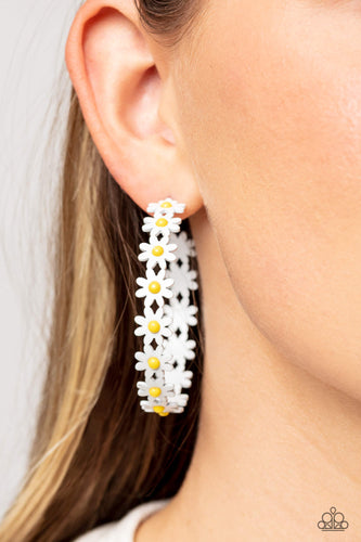 A dainty collection of white daisies with yellow centers blooms into a free-spirited hoop around the ear. Earring attaches to a standard post fitting. Hoop measures approximately 2