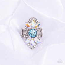 Load image into Gallery viewer, Exploding from the light blue surface, a trio of iridescent marquise-cut gems coalesces the top and bottom of the airy frame for additional eye-catching detail. Features a stretchy band for a flexible fit. Due to its prismatic palette, color may vary.  Sold as one individual ring.
