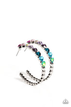 Load image into Gallery viewer, Featuring a scalloped heart frame, glittery heart rhinestones in shades of pink, iridescence, purple, blue, and a refracted green shimmer slowly decrease in size as they curve down the ear to meet dainty silver hearts for a romantic statement. Earring attaches to a standard post fitting. Hoop measures approximately 1 3/4&quot; in diameter. Due to its prismatic palette, color may vary.  Sold as one pair of hoop earrings.
