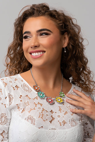 Dotted with dainty white rhinestone petal edges and white gem centers, a vibrant assortment of Burnt Coral, Samoan Sun, Orange Tiger, apple green, and tiffany blue flowers link below the collar for a playful pop of color. Features an adjustable clasp closure.  Sold as one individual necklace. Includes one pair of matching earrings.