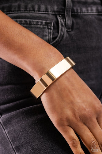 Featuring a sleek, high-sheen finish, a thick gold cuff asymmetrically wraps around the wrist, creating a tilted square centerpiece for a monochromatic staple. Features a hinged closure.  Sold as one individual bracelet.