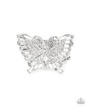Load image into Gallery viewer, Sparkling with round, teardrop, and emerald cut white rhinestones, a silver butterfly fearlessly flutters atop the finger for a statement-making finish. Features a stretchy band for a flexible fit.  Sold as one individual ring.
